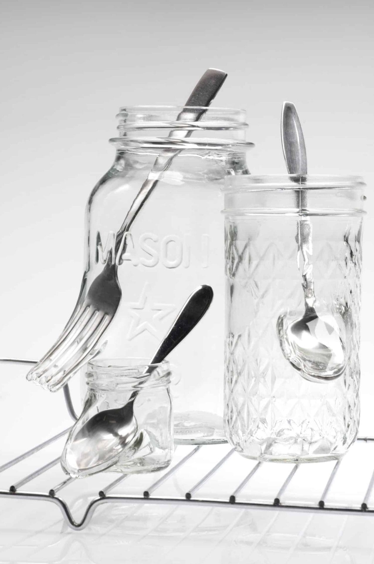 Detail of “Waste not want not,” Jelly jars, cutlery, stainless steel, 8.75 x 16.25 x 9 inches, photo credit: Elizabeth Torgerson-Lamark