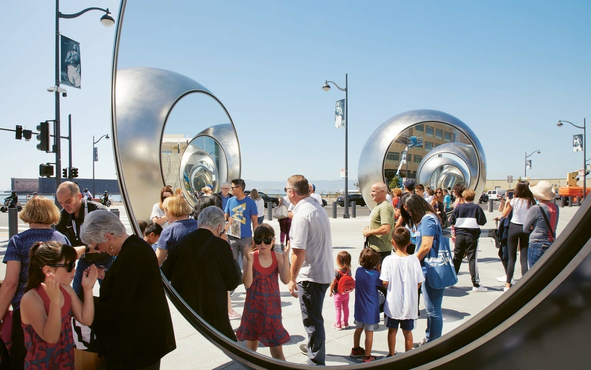 “Seeing Spheres” (2019), stainless steel, glass, silver, fiberglass, LEDs, 4.8 x 22 x 22 meters, each sphere, diameter 480 centimeters, installation view at Chase Center, San Francisco. Photo by Matthew Millman