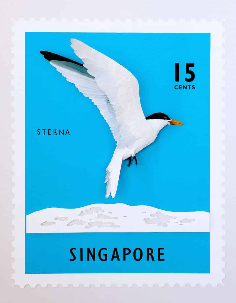 postzegel met papieren vogel